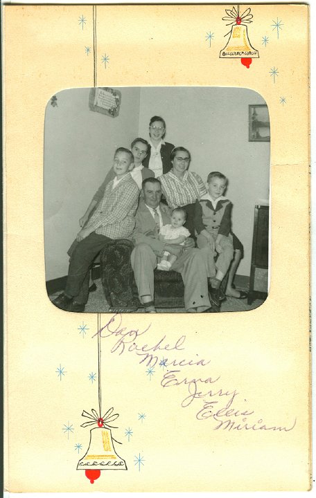 1321A.jpg - The Dan & Rachel Stutzman Family, 1961c.  Dan sitting holding Miriam, Ellis on right, Jerry on left, Erna, upper left, Rachel, right, Marcia back.
