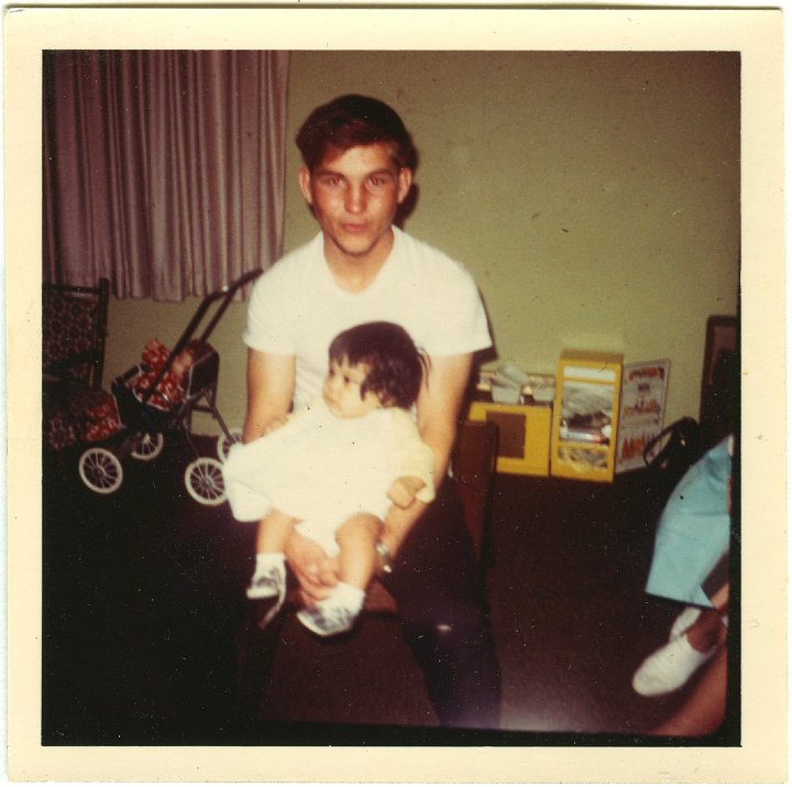 1362.jpg - Jim Decker holding a doll.  1965c